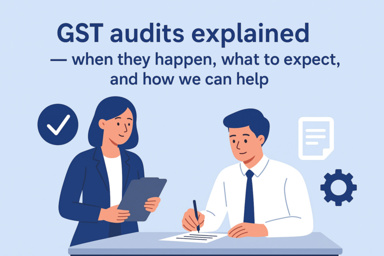 Illustration showing a businesswoman and a businessman reviewing and signing GST audit documents, with icons of a checkmark, gear, and document around them, under the heading “GST audits explained — when they happen, what to expect, and how we can help.” The image conveys professional assistance and audit readiness.